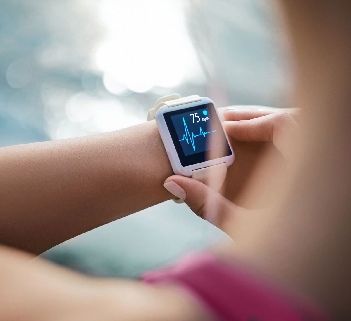 Close up of smartwatch on someone's hand as it's monitoring heart rate