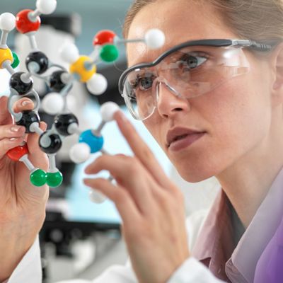 Scientist holding molecular model
