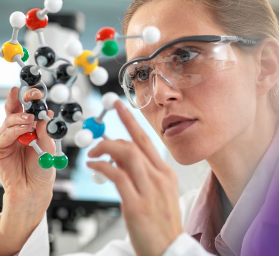 Scientist holding molecular model
