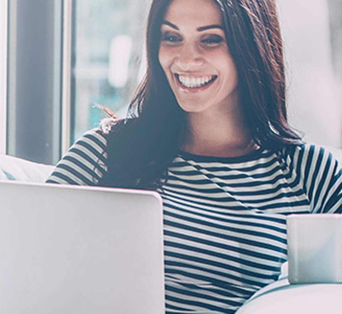 women looking at her laptop